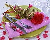Place-setting decorated with carnation and thyme