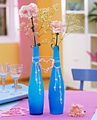 Carnations & Gypsophila in glass vases with heart & pearls