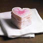 Heart-shaped petit four with pink icing