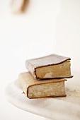 Two old books on a marble slab