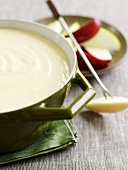 Cheese fondue with apple slices