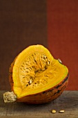 A Hokkaido squash with a portion removed