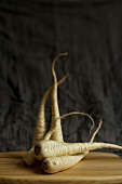 Parsnips on a wooden board