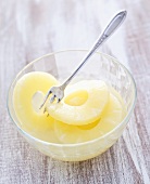Pineapple slices in a glass bowl