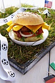 Burger with national flags on small football pitch