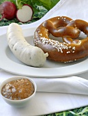 Weisswurst (Bavarian sausage) with soft pretzel and mustard