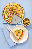 Courgette and pepper pizza with olives