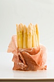 White asparagus wrapped in ham