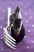 Aubergine beside fork