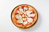 Pizza topped with tomato sauce and mozzarella