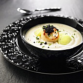 Cauliflower soup with scallop, black caviar and leek