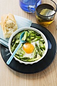 Fried eggs with green asparagus