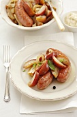 Sausages with apples and juniper berries