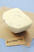 Boschetto cheese (Italian semi-hard cheese with truffle) on paper