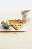 A piece of apple tart with agave and rosemary