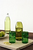 Green glasses and green glass vase (cut down bottles)
