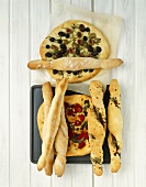 Flatbread and bread sticks with vegetables and herbs