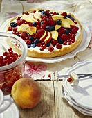 Berry and peach tart with coconut cream