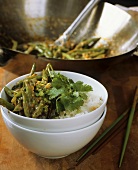 Green beans with peanut sauce on rice
