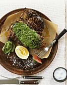 Bistecca alla fiorentina (T-bone steak with green sauce)