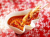 Skewered shrimps with pepper dip