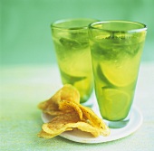 Two glasses of mojito with crisps