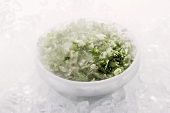Bowl of frozen herbs on ice