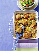 Chicken with oranges, potatoes and rosemary, oven-roasted