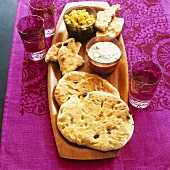 Indian naan bread with raita and mango salsa