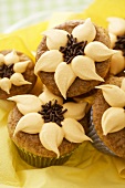 Orange nut muffins with orange cream & chocolate sprinkles