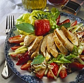 Lettuce with strawberries, sprouts and chicken breast