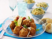 Meatballs with tomato sauce, spaghetti in background