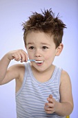 Small boy eating yoghurt