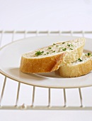 Two slices of baguette with herbs in a fridge