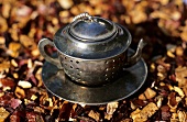 Tea infuser in shape of teapot and fruit tea
