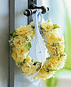 Wreath of narcissi and primulas on door handle