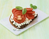 Soft cheese and tomato on bread