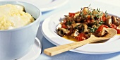 Cheese polenta with mushrooms and tomatoes