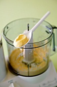 A spoonful of mayonnaise on food processor