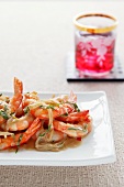 Satay prawns with onions and herbs