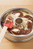 Marble cake mixture in a ring cake tin