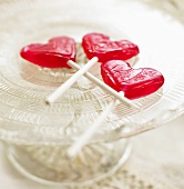 Heart-shaped red lollipops