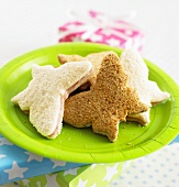 Butterfly-shaped sandwiches on green paper plate