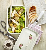 Caesar salad with chicken in lunch box