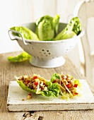 Chinese-style pork in lettuce leaves