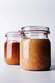 Apple puree in two preserving jars