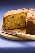 Apricot cake with chocolate chips, a piece removed