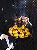 Chimney sweep serving deep-fried rice balls for New Year's Eve