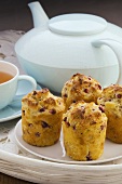 Muffins with pomegranate seeds, tea