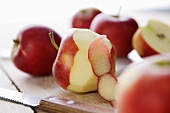 Red apples, whole, peeled and halved
